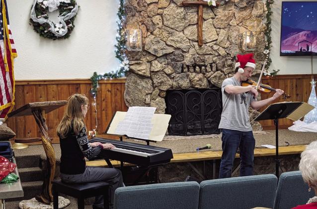 The River of Life Assembly of God Christmas program included a fiddle/violin arrangement played by Phil Hassey with Nancy Peterson accompanying. Photo courtesy of Deb Straub