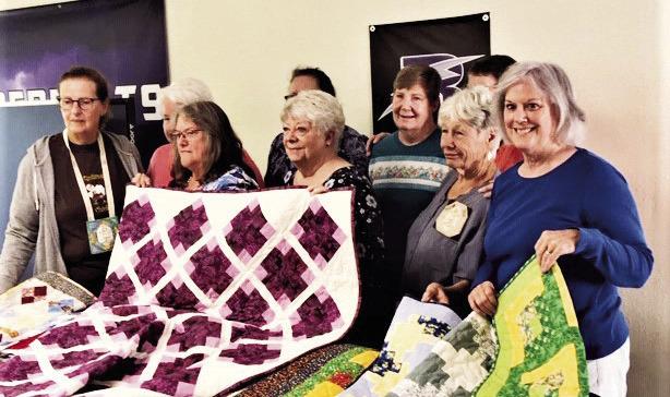 The hospice quilting project group of 13 quilters from the Scrappy Ladies Quilt Guild in Colorado City. Photo by Shirley PIgg