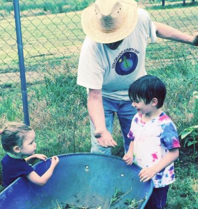 David Barber and his grandchildren add to the Community Garden in Colorado City. Courtesy Photo
