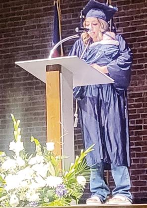 A 2023 GOAL Graduate delivers her speech with her recently born son. The little boy was premature and needed several surgeries. With help from GOAL staff, this determined young lady finished her classes from the hospital!