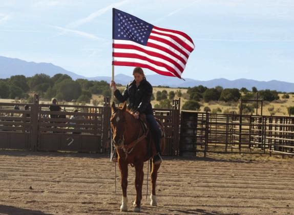 Donna Fern and Trigger carrying the American Flag at a local rodeo Courtesy Photo