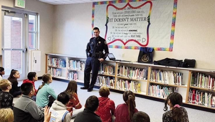 Sheriff Lucero conducts a presentation in January to Haaf Elementary students on the Sheriff’s Office K-9 Unit and internet safety for kids.. Courtesy Photo