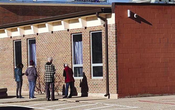 Jericho Walk participants gathered at a corner of Rye High School to offer prayers. Photo by Shirley Pigg