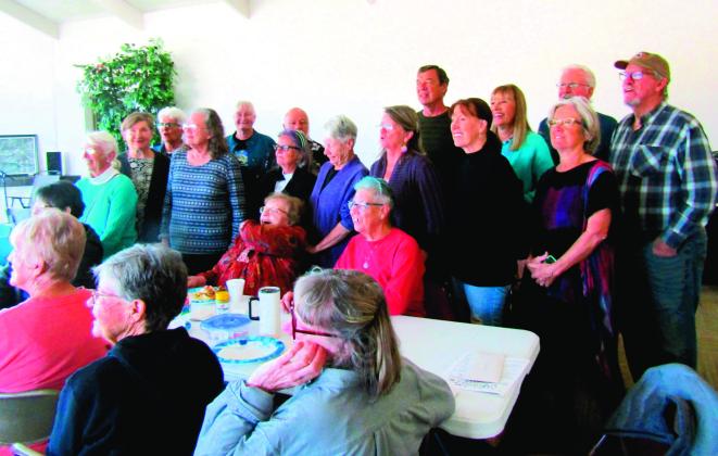 Former VFC President Susan Kalman was surrounded by friends at a breakfast held in the community center bearing her name. Photo by Shirley Pigg