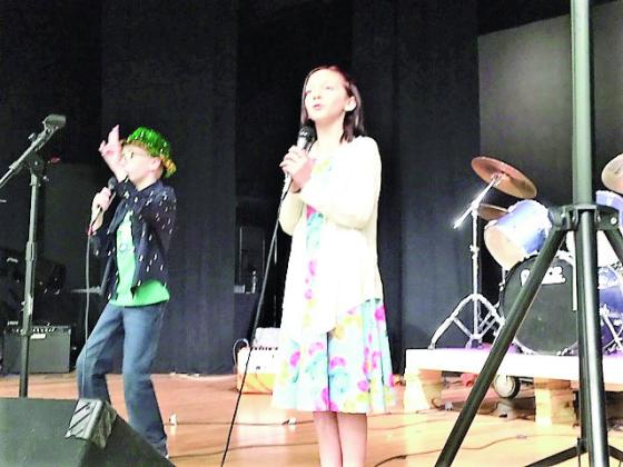 A lively duo singing on stage at Rye High School Art Show and Concert on March 8th. Photo by Shirley Pigg