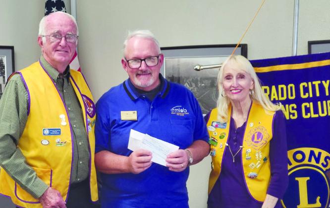 Colorado City/Rye Lions Club members Dennis (L) and Paula Maroney presenting a $500 check to a Rocky Mountain Lions Eye Bank representative . Courtesy Photo