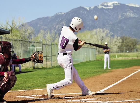 Will Hamler drives the ball in to left field for a hit. The entire Rye team seemed to gel last week with three impressive victories. Photo by Karen Rochester