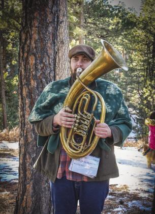 Quinn Bryant sounded the horn to start the Yule log hunt. Courtesy Photo