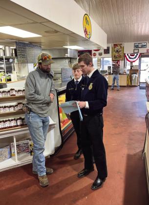 FFA members talk with Shane Millberger of Millberger Farms about sponsorship for the 7th Annual Rocky Mountain Oyster Fry. Courtesy Photo