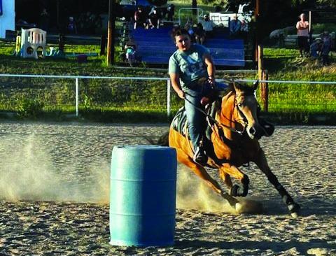 RCC Saddle Club members are enjoying Thursday evening gymkhanas. Here Ashlynn Cozzetto guides her horse around the barrel pattern. Courtesy Photo