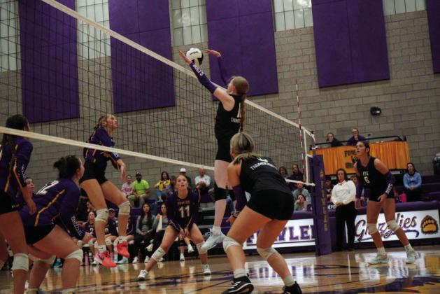 Hayley Newitt blocks a shot in Rye High School volleyball action last week. Courtesy Photo