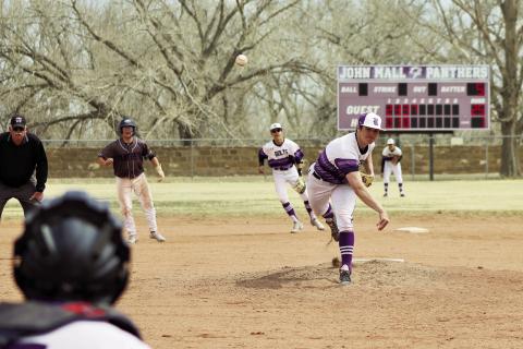 Joe Valdez fires a strike in a ball game against John Mall. Photo by Karen Rochester
