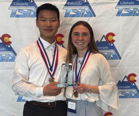 Adin Poehlein and Ozzira Garrison with their first-place trophy and medals Courtesy Photo
