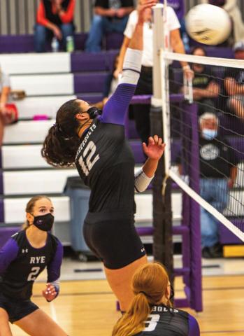 Rye's lady T-Bolts made a comeback in the 3rd and 4th games against The Vanguard School with 25-21, 25-11 scores, but lost to Vanguard 10-15 in the 5th game for a 2-3 loss. Sophomore #12, Jordan Holgerson slamming the Courser's defense with another hard hit. Photo by Sue Barcus