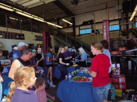 The famous FFA BBQ was a busy place as FFA members and volunteers served meals. Photo by Shirley Pigg