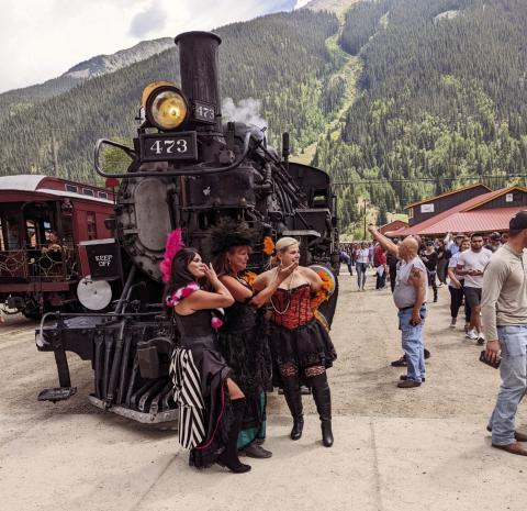 Saloon girls meet the Durango &amp; Silverton Narrow Guage train at Silverton, Colorado Photo by Lori Kraus