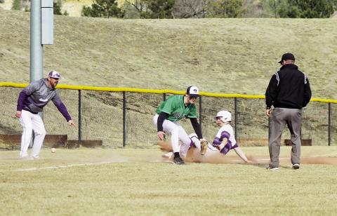 RHS Baseball playerJoe Valdez, as Coach Graham tells him to 'Get Dirty' ,coming into 3rd at the March 14, St. Mary’s High School contest. Photo by Karen Rochester