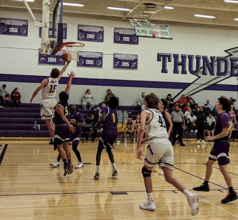 Rye High School’s Codah Graber (#15) has a nice reverse layup during the Boys varsity BB game against Ellicott on Friday night on the hometeam court. Photo by Deb Straub