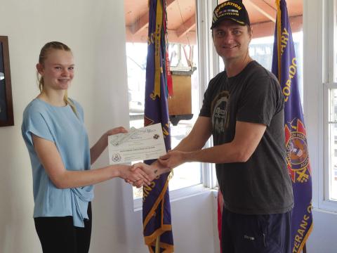 Matt Akers hands Molly Chandler a check and certificate for her 2nd place winning essay in the Voice of Democracy Contest sponsored by the local LTC Fred A. Ettleman Veterans of Foreign Wars Post #7305. Photo by Shirley Pigg