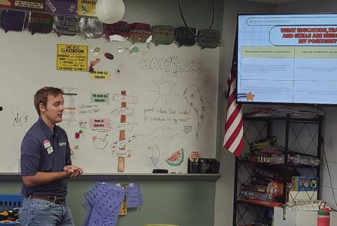 Representatives of Sunwest Credit Union talk finances and careers with Craver Middle School students. Photo by Shirley Pigg