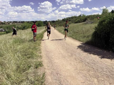 David Maroney (center) was the highest finisher for the Rye High School Boys Cross Country team at the Cheyenne Stampede. Courtesy Photo