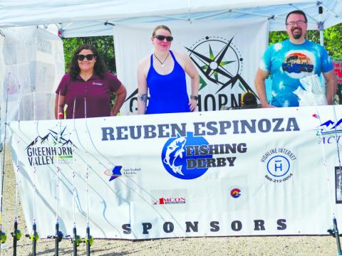 Greenhorn Valley Chamber of Commerce members gathered early Saturday morning to open the registration booth for the fishing derby. Pictured (L-R) are Lauren Azuremar, Katherine MacLeod,and Joshua MacLeod. Photo by Shirley Pigg