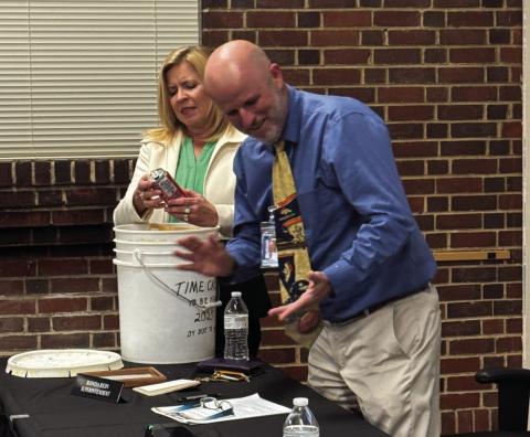 D70 Superintendent Ronda Rein and Assistant Superintendent Bob DiPietro removing items from the time capsule. Courtesy Photo