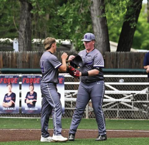 Branson Burbidge(44) and Grant Clennin(4) discuss strategy with runners on base Courtesy Photo