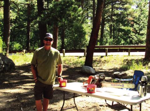 John Christenson, owner of Native Lumber, parent, and District 70 school board member, sets up his station during Science Day. A little later John had groups of students that he was teaching about alternative forms of energy. Photo by Shirley Pigg
