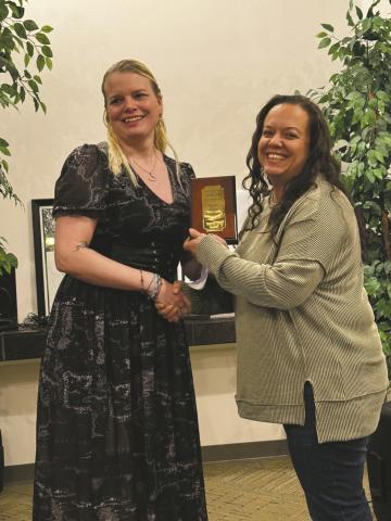 Branch Manager Kourtny Quillen accepts the Business of the Year Award for Bank of the San Juans at the Greenhorn Valley Chamber dinner on Saturday.
