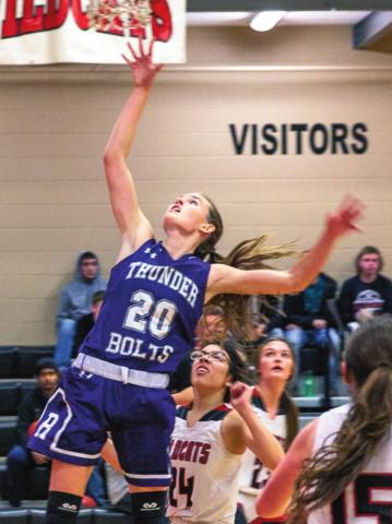 Another game and another win for the Lady T-Bolts who are now 9-0 overall and 3-0 league. Rye beat Holly High School 58-14 on Friday, Jan. 7 at an away conference game. During the second quarter Senior Sophie Adamson #20 achieved her 1000th point and was announced on the loudspeaker to cheers by the crowd from both schools. Adamson finished with 17 points, 6 assists and 7 rebounds. Photo by Sue Barcus