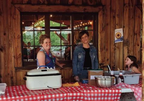 Volunteers cheerfully served a mouth-watering smoked brisket dinner at the Faith Circle's Mountain Aire Festival Photo by Shirley Pigg