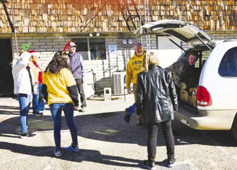 Colorado City Rye Lions and Leo Club members load a vehicle with food and toys to complete their annual Christmas drive. Courtesy Photo