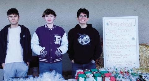Wesley Mascarenas, Chris Scott, and Nate Cole held a bake sale at Ace Hardware to raise money for uniforms and travel costs to play soccer. Photo by Shirley Pigg