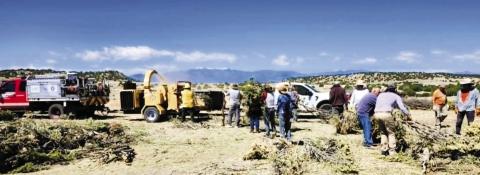 Many Hatchet Ranch homeowners and FireWise volunteers turned out on Friday, May 8, to help chip the slash piles that they have cleared away from their homes.