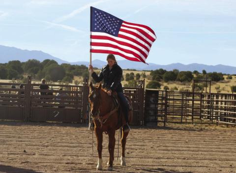 Donna Fern and Trigger carrying the American Flag at a local rodeo Courtesy Photo