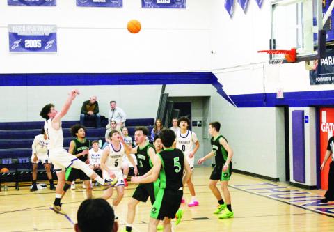 Jay Graham scores a basket against St. Mary’s. Photo by Sofia Crosson