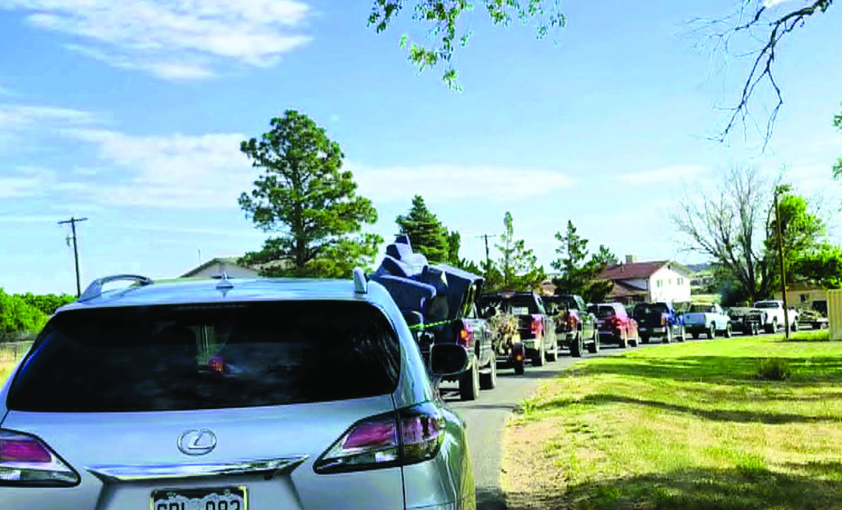 Well before the start time of 8:00 a.m., the line for the Community Cleanup Day stretched from the Colorado City Recreation Center all the way up Cuerno Verde to Lake Beckwith. Photo by Shirley Pigg