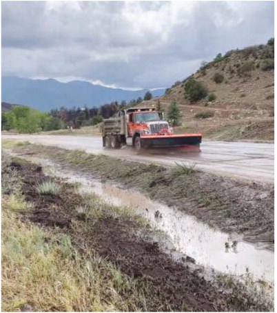 CDOT road crews were called out to assist with water and debris flooding Hwy 165 just below the burn area near Nomad Group, on Thursday, August 13. Rain fell hard and fast, creating what resembled a cross between a waterfall and a mudslide coming down the hill and across Hwy 165. Water was reportedly over a foot deep on Hwy 165. Courtesy Photo