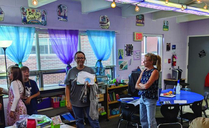 Third grade teacher Lindsay Jarbo (right) visits with parents and students at the Rye Elementary open house last Thursday evening Photo by Terry Kraus