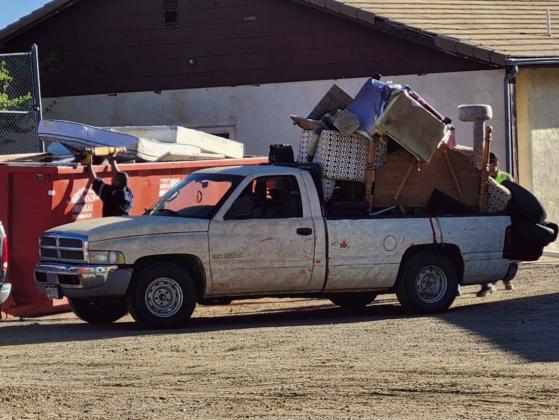 Volunteers withstood the heat and worked hard to keep up with the demand to unload vehicles. Photo by Shirley Pigg