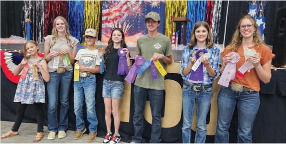 Greenhorn Kickers with their County Fair ribbons. L-R: Lucy Chandler, Molly Chandler, Bryer Power, Kimmie Power, Zack Mansfield, Lena Chandler and Clara Chandler. Not Pictured: Tommy Hart Courtesy Photo