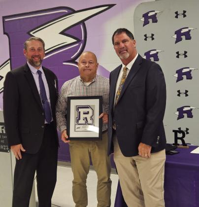Matt DeJong (L), Principal of Rye High School, and Jeff Bailey (R), long time RHS Football Coach, present a Hall of Fame plaque to Frank Whalen. Courtesy Photo
