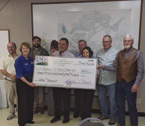Members of the USDA and Colorado Rural Water join CCMD Board Members to receive a combination grant and loan for a pretreatment water facility in the amount of $16 million. Photo by Terry Kraus