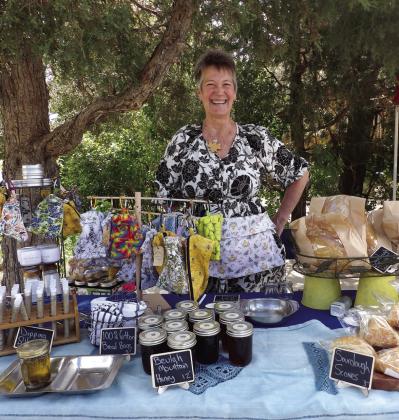 One of the Beulah Farmer’s Market vendors, Brook Courchaine, displays a variety of baked, canned and fabric items for sale. Courtesy Photo