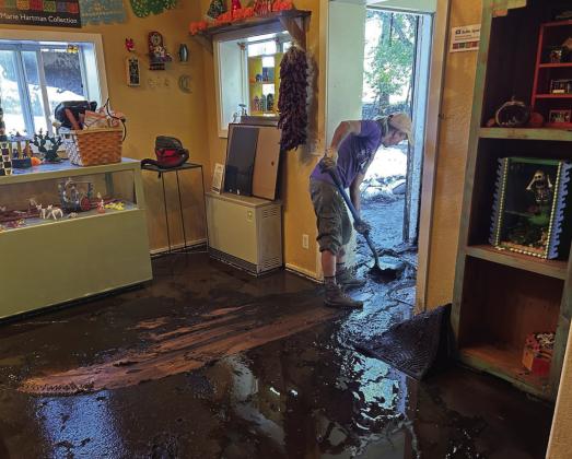The floors inside the History Center were covered in mud and water. Courtesy Photo