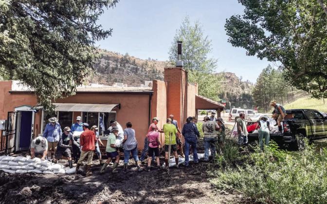 Volunteers turned out in full force to help with setting up sandbags around the hiistory center. Courtesy Photo