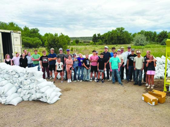 Community volunteers, including youth have been turning out to help fill sandbags to help with flooding. Courtesy Photo