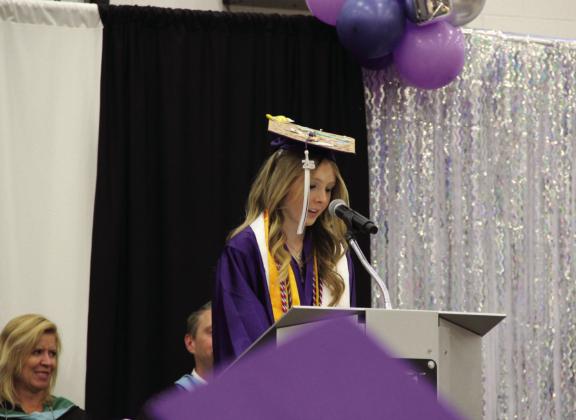 Olivia Garrison, Valedictorian, shares memories and future hopes with her graduating class. Photo by Terry Kraus