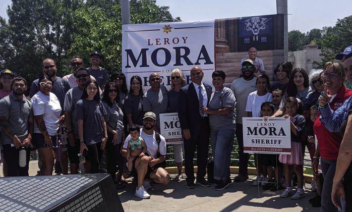 Leroy and Kathy Mora, surrounded by supporters, officially announced Mora's candidacy for Pueblo County Sheriff. Courtesy Photo